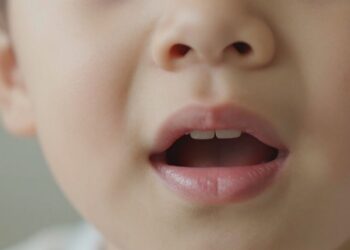 Close-up of a child's ear, nose, and throat.
