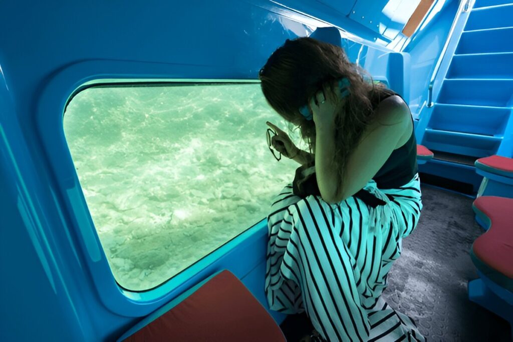 Woman sit in glass bottom boat | JustPicked Woman sit in glass bottom boat