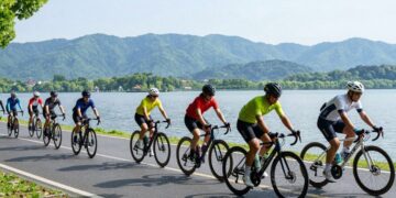 Cyclists ride bikes near Dal Lake for Cyclothon 2026 | JustPicked Cyclists ride bikes near Dal Lake for Cyclothon 2026.