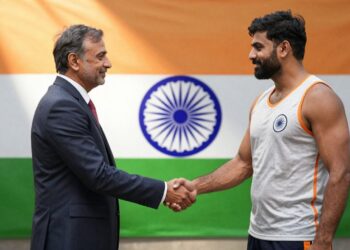 Handshake symbolizing agreement on sports governance.