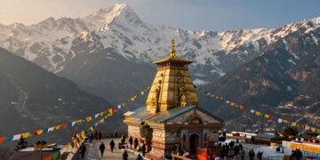 Kedarnath Temple in Himalayas with pilgrims on a path | JustPicked Kedarnath Temple in Himalayas with pilgrims on a path.