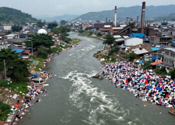 Polluted river and textile waste in Panipat.
