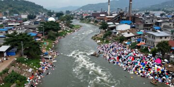 Polluted river and textile waste in Panipat.