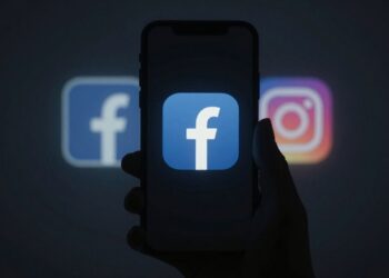 Facebook and Instagram outage symbol on a dark phone screen.