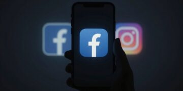Facebook and Instagram outage symbol on a dark phone screen.
